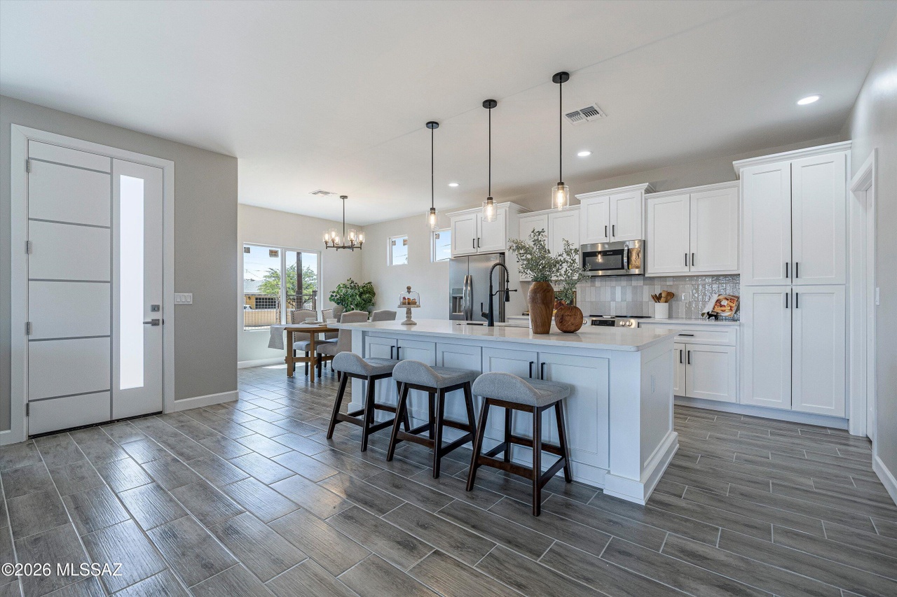 Kitchen with island and pendant lights